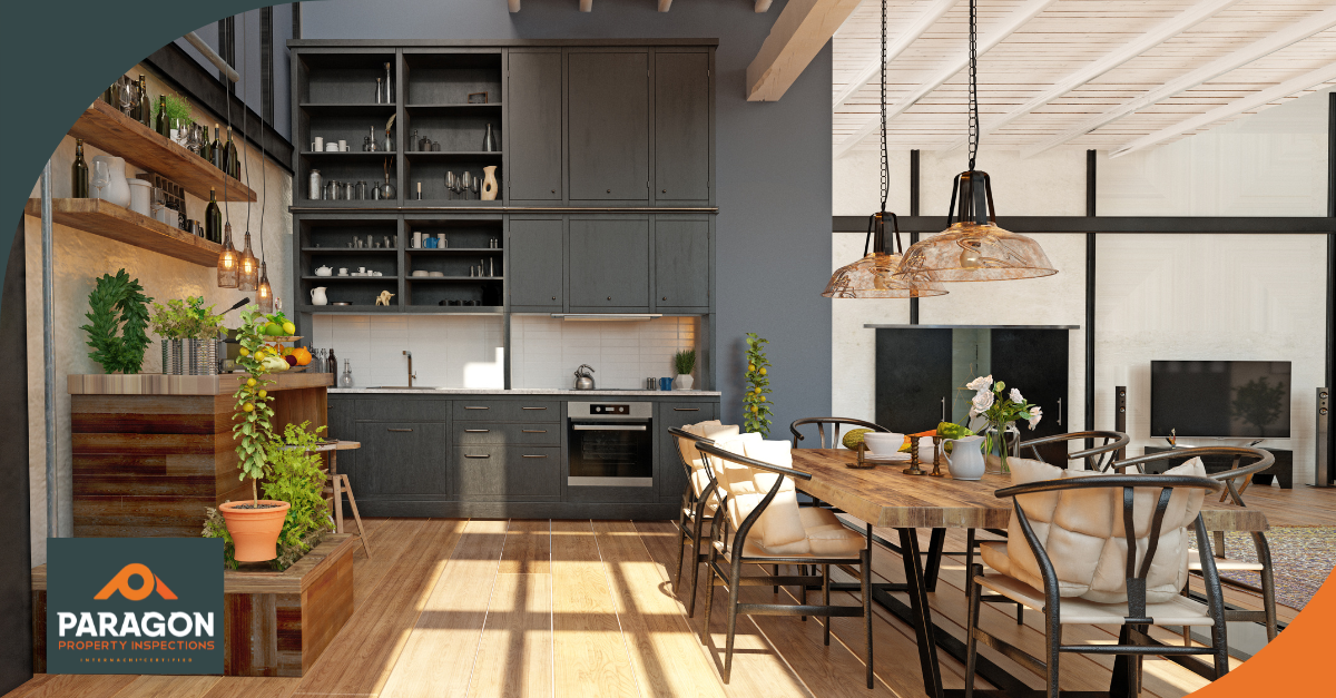 Modern kitchen and dining room with open shelving, stylish decor, and wood floors, featuring a table and seating area.