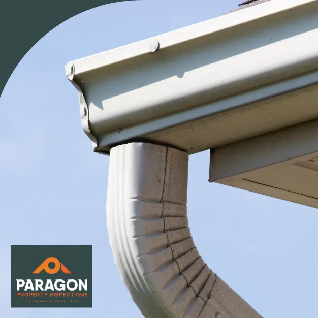 Close-up of a home gutter and downspout system.