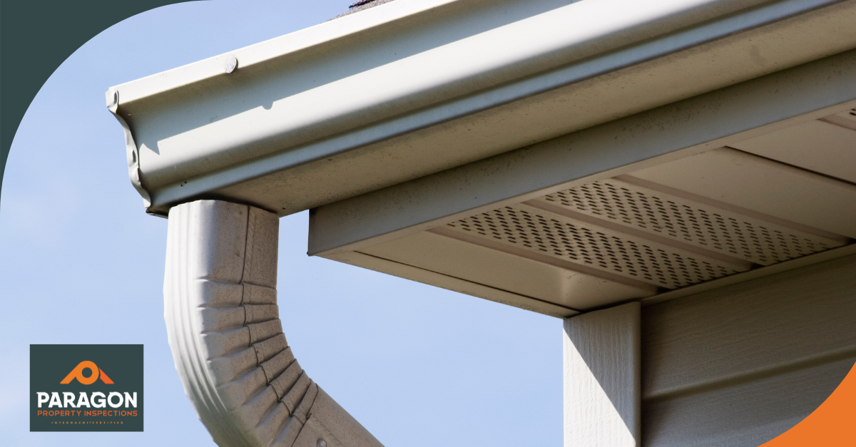 Close-up of a home gutter and downspout system.